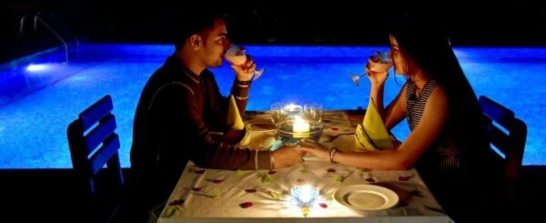 Infinity pool with forest backdrop at couple-friendly resort Wayanad